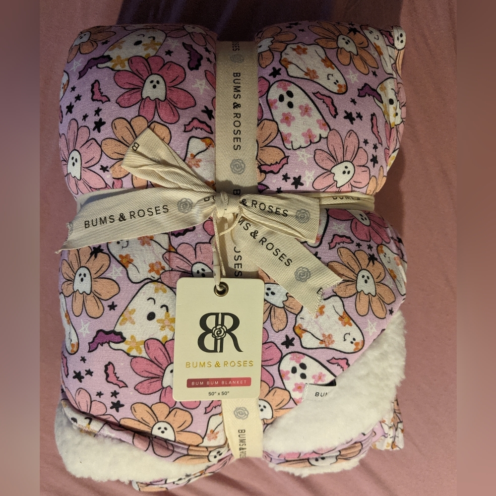 Bums and roses plush booogie blanket. New but not in bag.